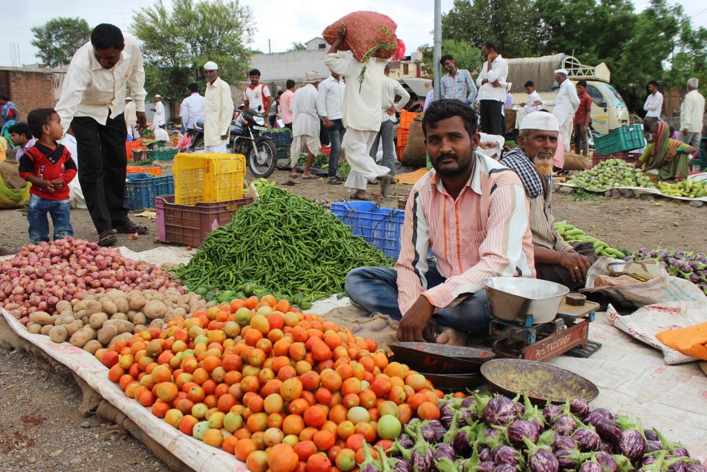 A man selling tomatoes