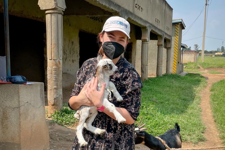 Kathryn Merckel holding a baby goat