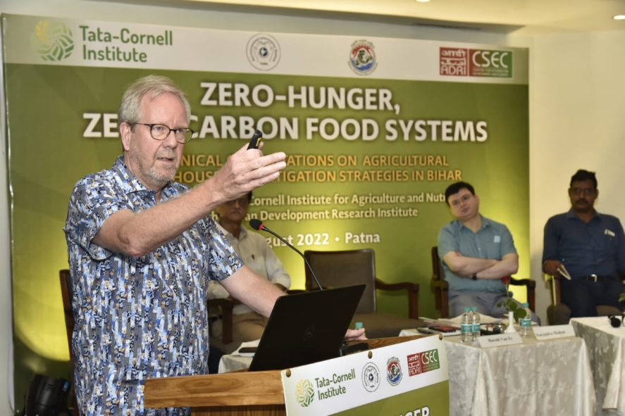 Harold van Es speaking at a podium