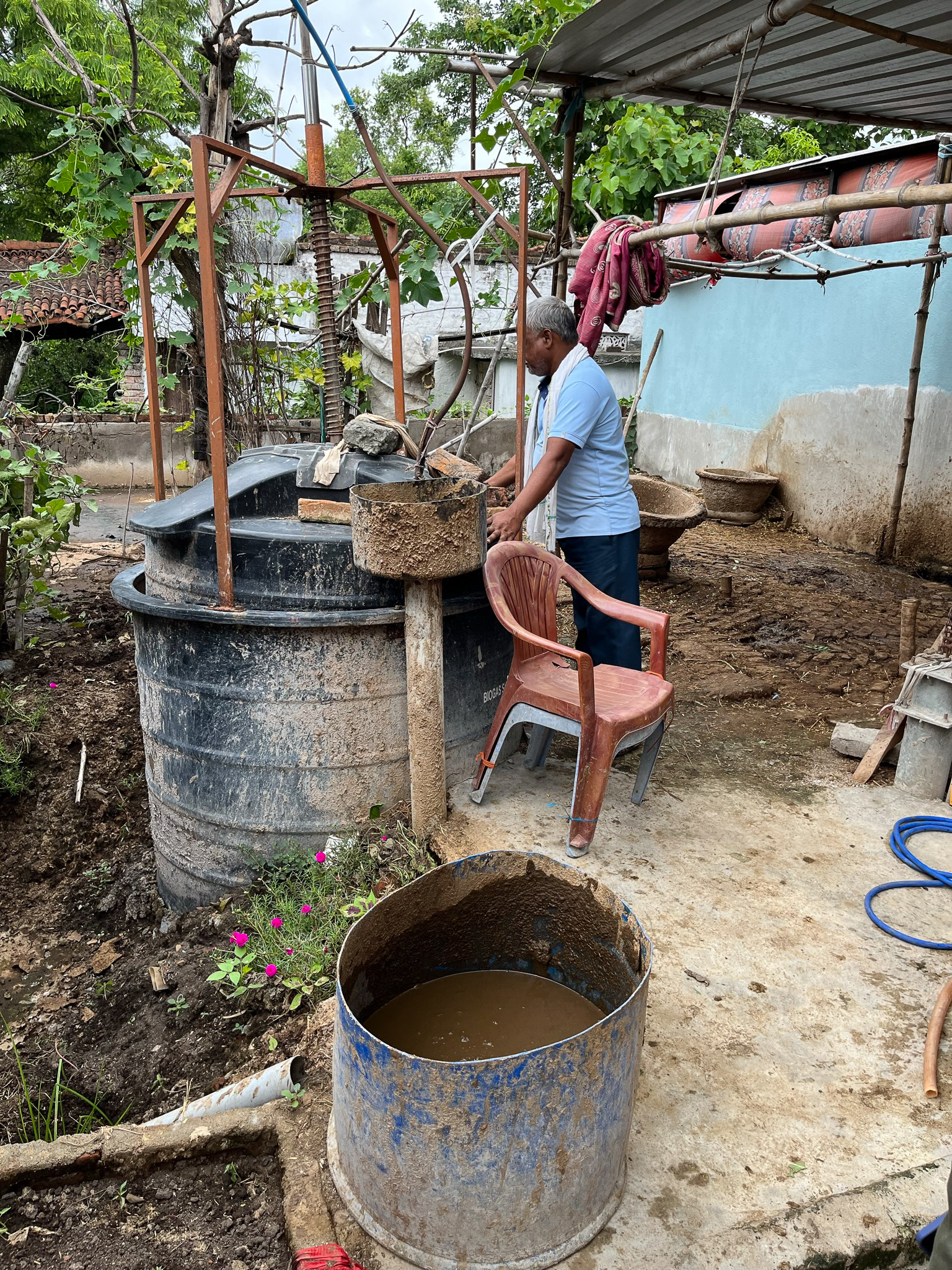 A farmer making biogas