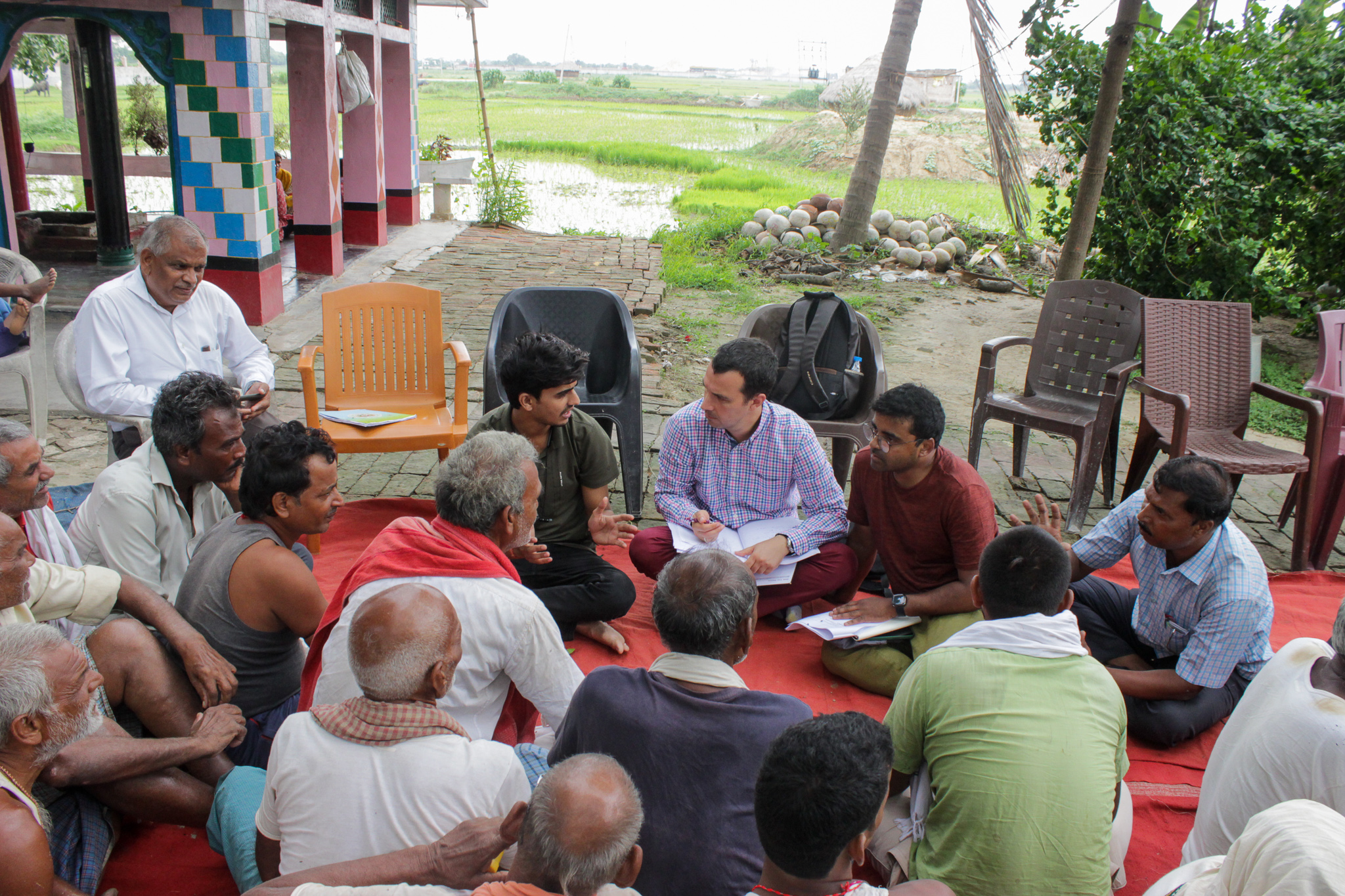 TCI researchers talking with farmers