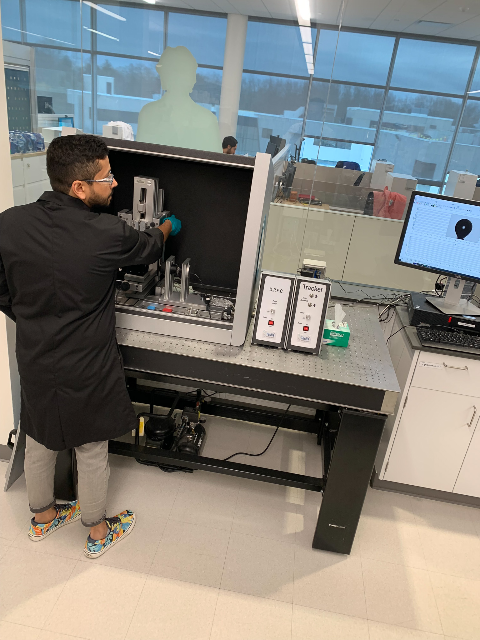 Rohil Bhatnagar working with lab equipment