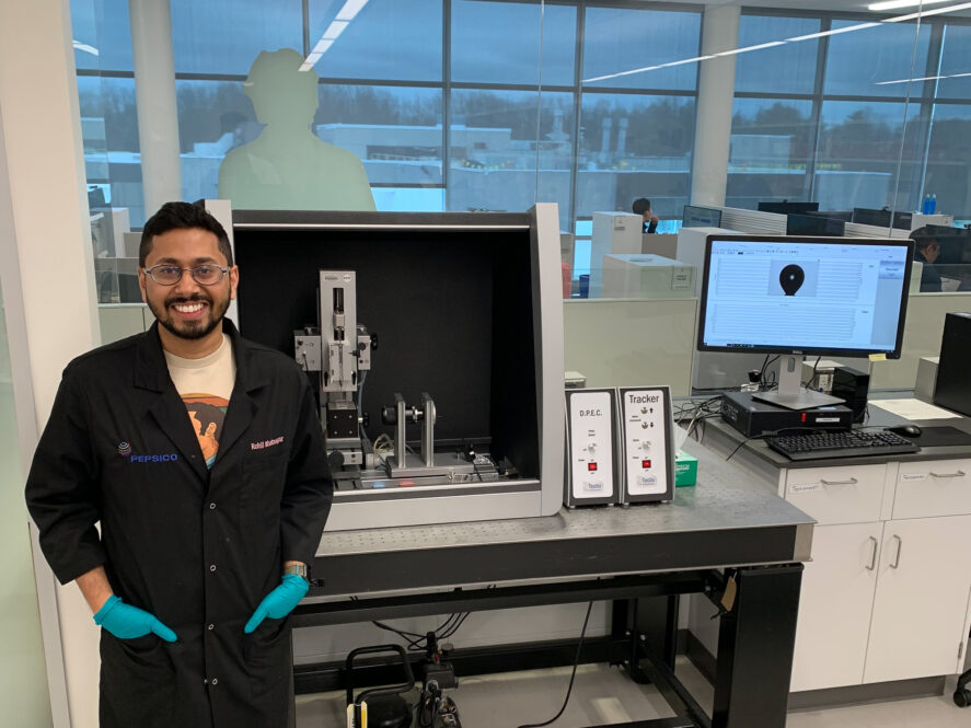 Rohil Bhatnagar standing in a lab