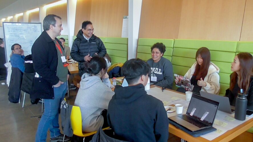Students and mentors interacting at the Digital Ag Hackathon