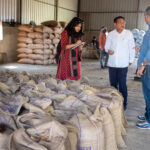 Pallavi Rajkhowa taking notes at a soybean warehouse