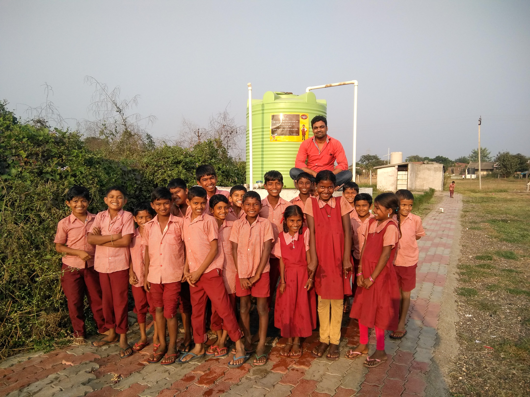 Kasim Saiyyad posing with a group of children