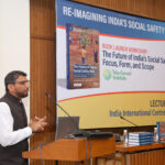 Andaleeb Rahman speaking at a podium during a book launch event