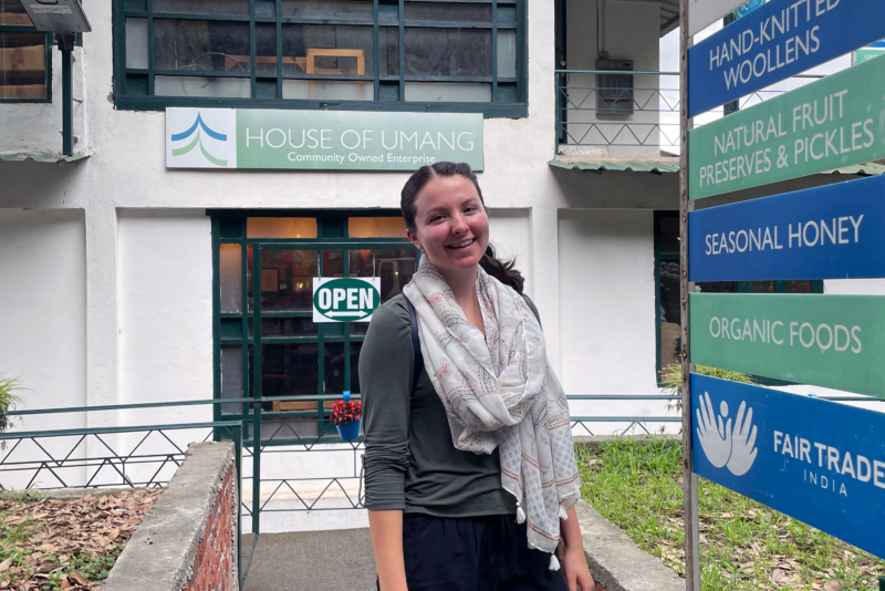 Grace Dunham standing outside of the House of Umang shop