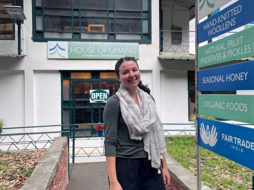 Grace Dunham standing outside of the House of Umang shop