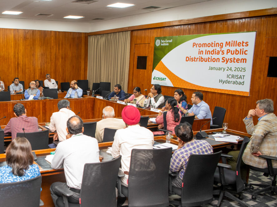 A group of people sitting around a conference room