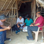 Shree Saha speaking with a group of people