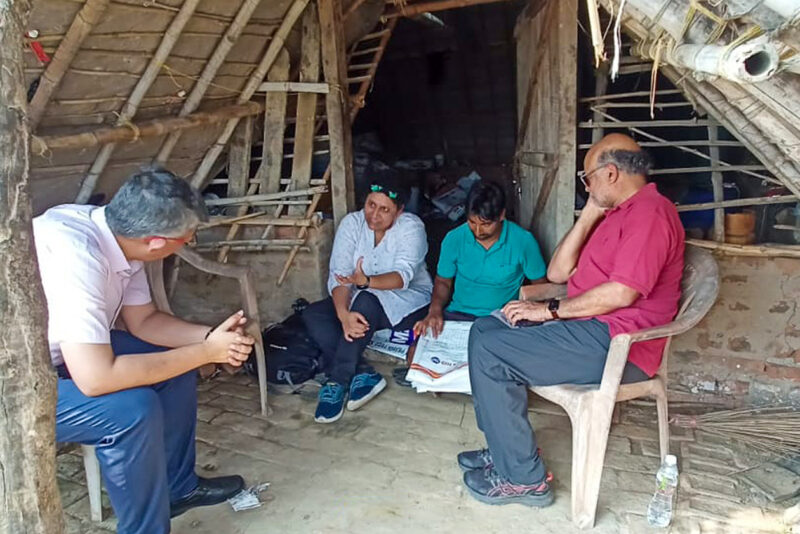 Shree Saha speaking with a group of people