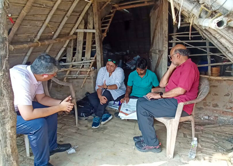 Shree Saha speaking with a group of people