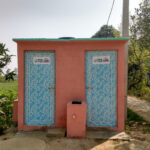 A public bathroom in India with two doors