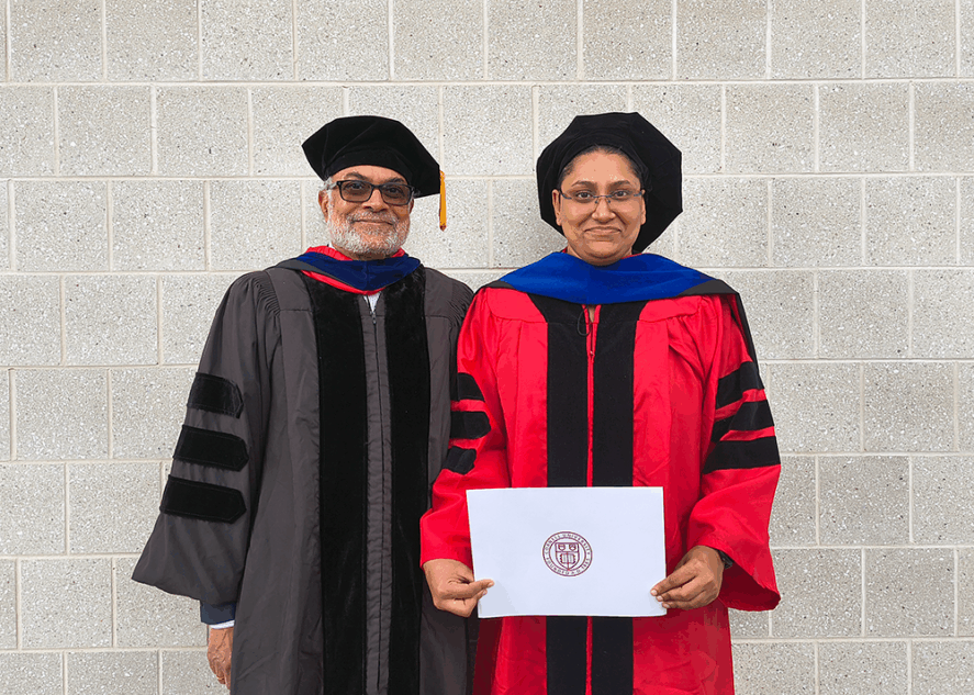 Prabhu Pingali and Shree Saha wearing academic regalia