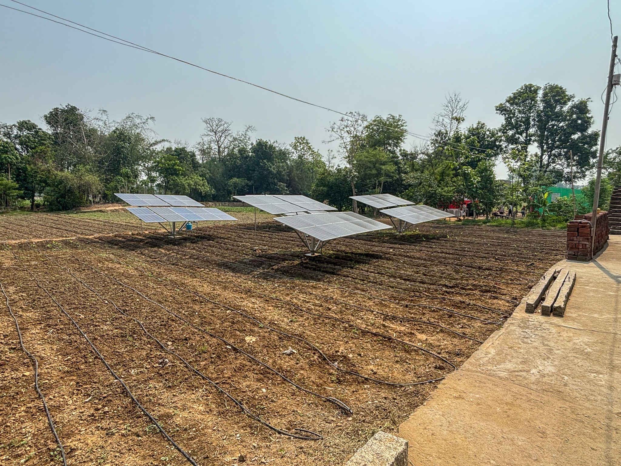 Three solar panels on farmland