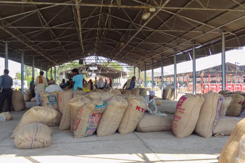 Bags of grain on display at a market