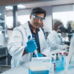 A scientist using a micropipette in a laboratory
