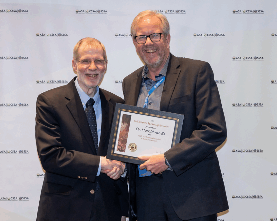 Harold van Es receiving an award