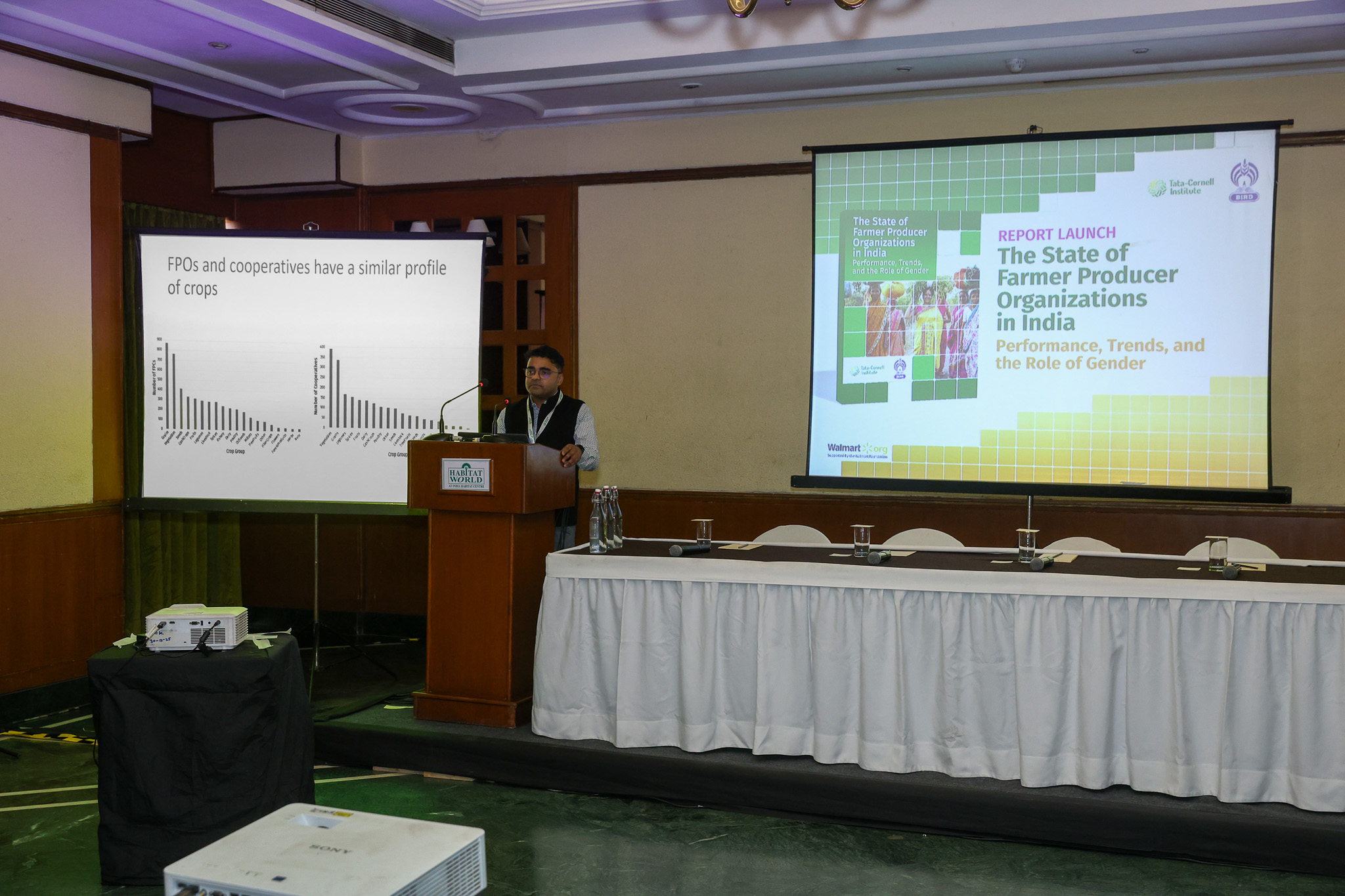 Mathew Abraham speaking at a podium