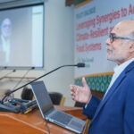 Prabhu Pingali speaking at a podium