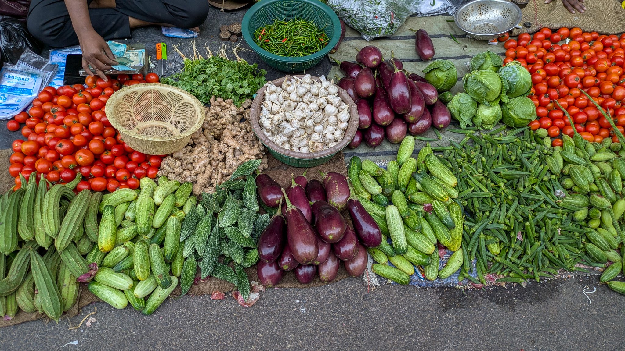 Eggplant and other vegetables on display at a market