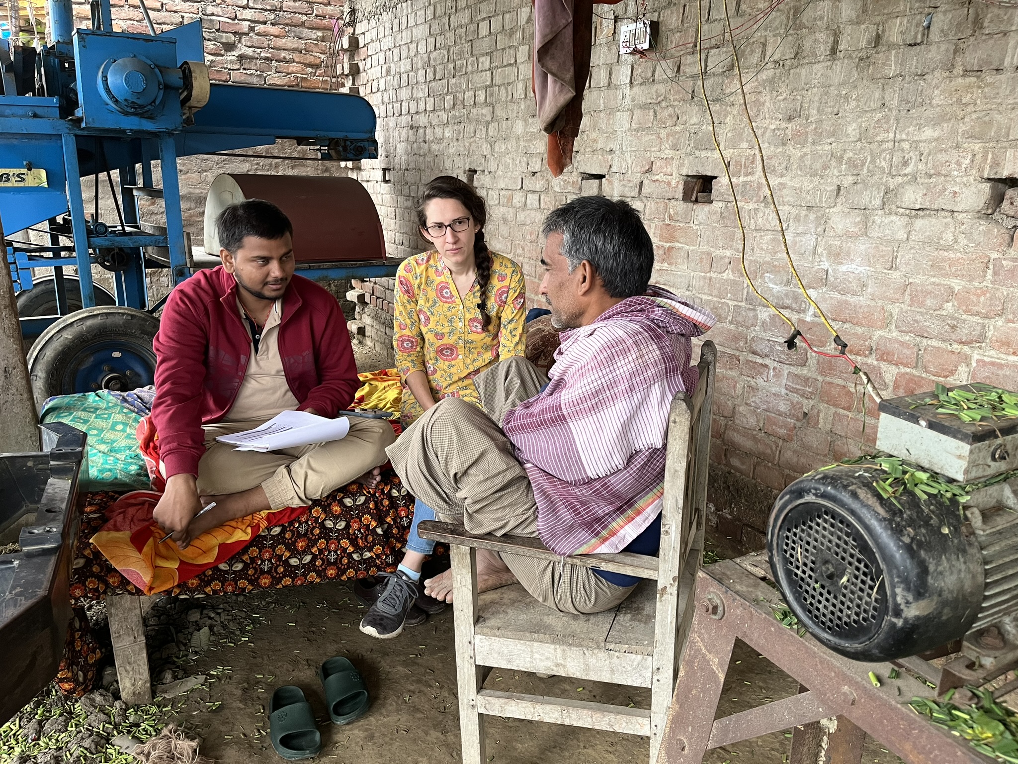 Kiera Crowley and a colleague interview a farmer